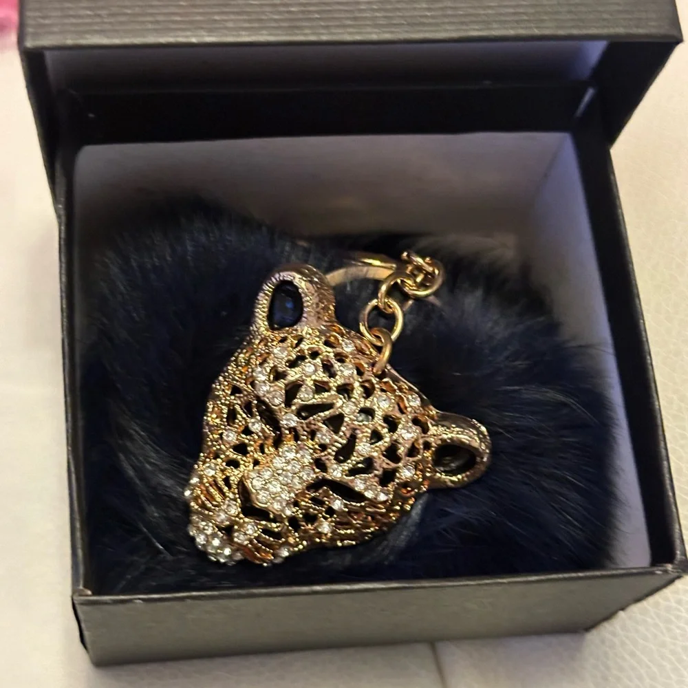 Leopard pompom bag charm key ring navy blue